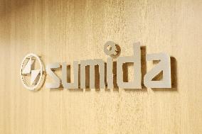 Sumida Corporation signboard and logo